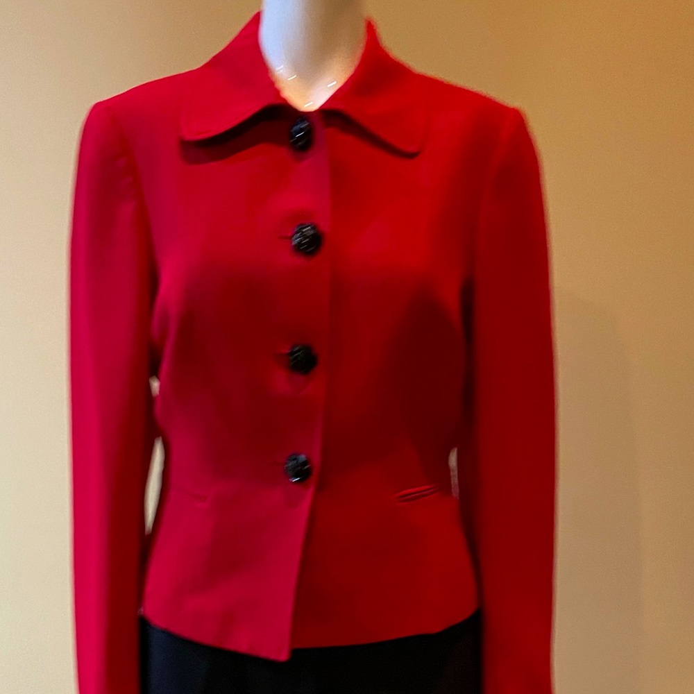 Suiting up in red - check out the flower detail on the buttons!